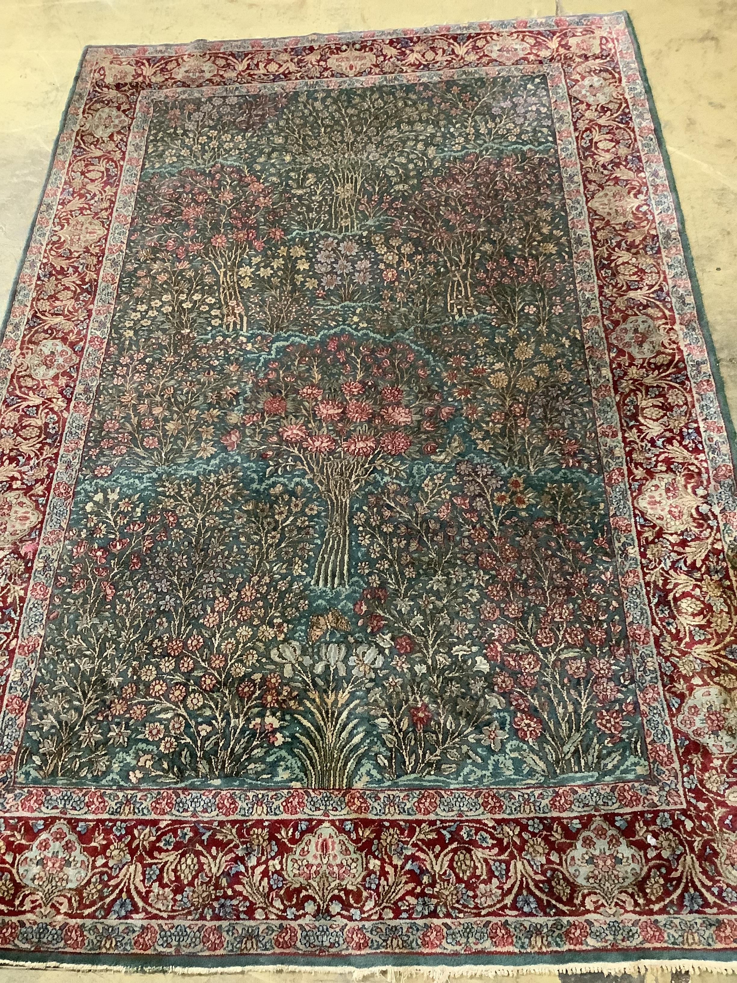 An Isphahan green ground rug, 232 x 152cm